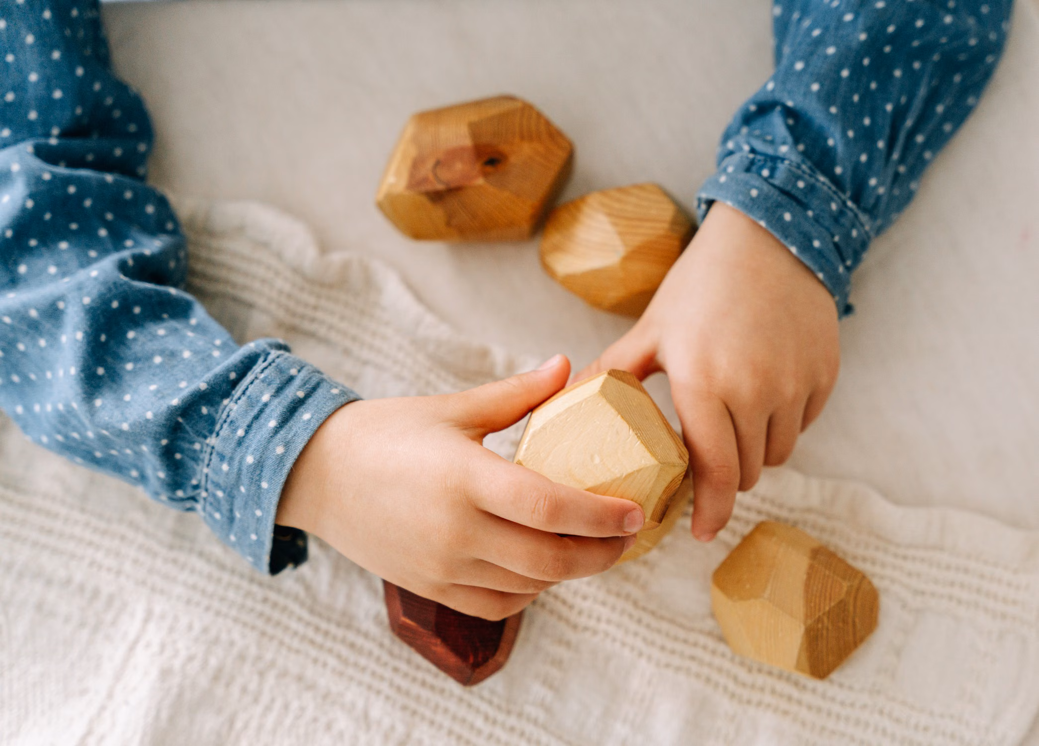 A child playing with wooden blocks